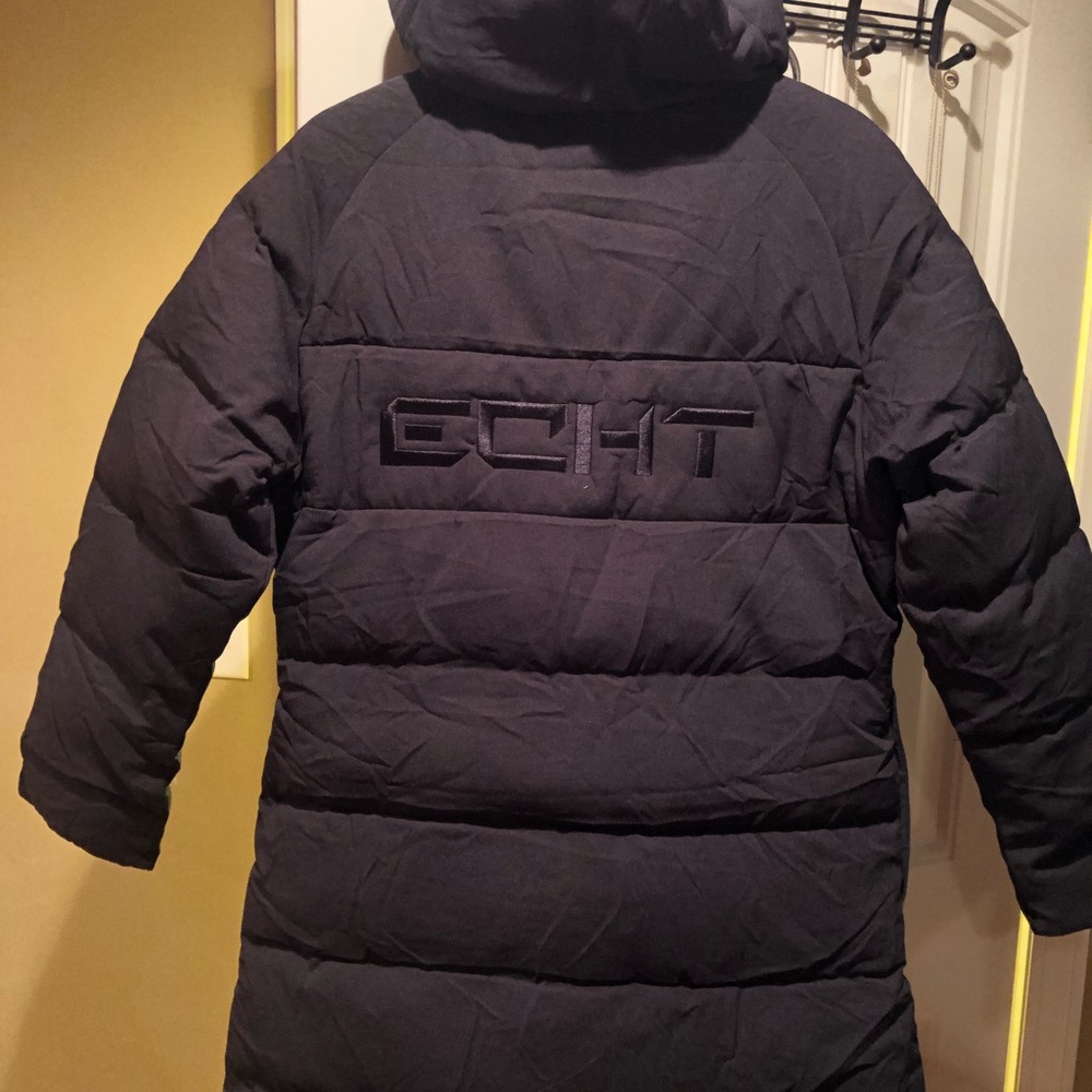 Keep the cold out in the Essentia Down Long Jacket

- Full front zip
